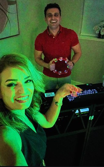 DJ Alphire and a guest at the DJ booth