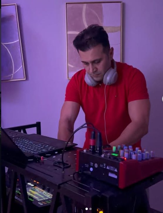 DJ Alphire performing a live set on pro DJ equipment