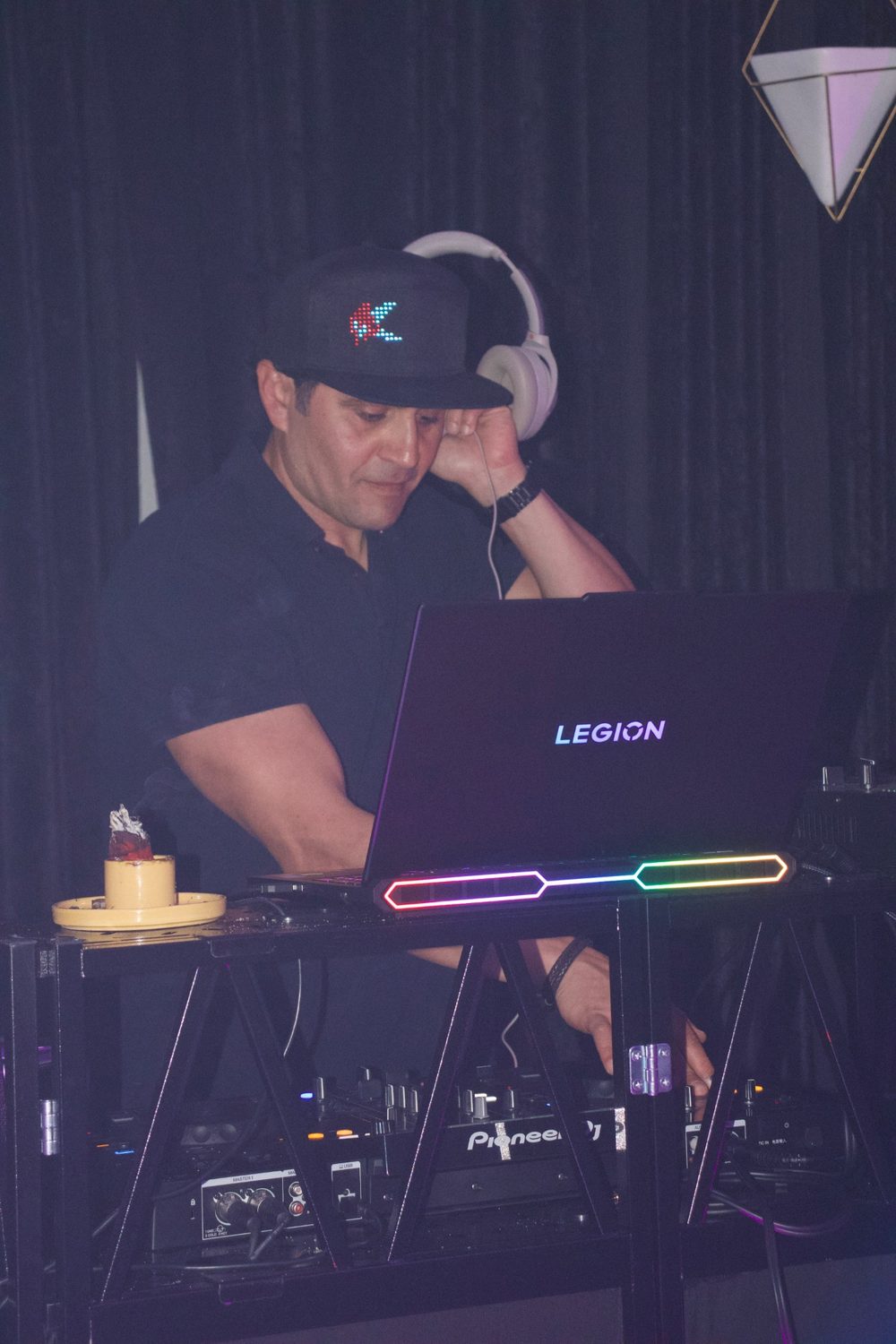 DJ Alphire on the headphones cueing the next track